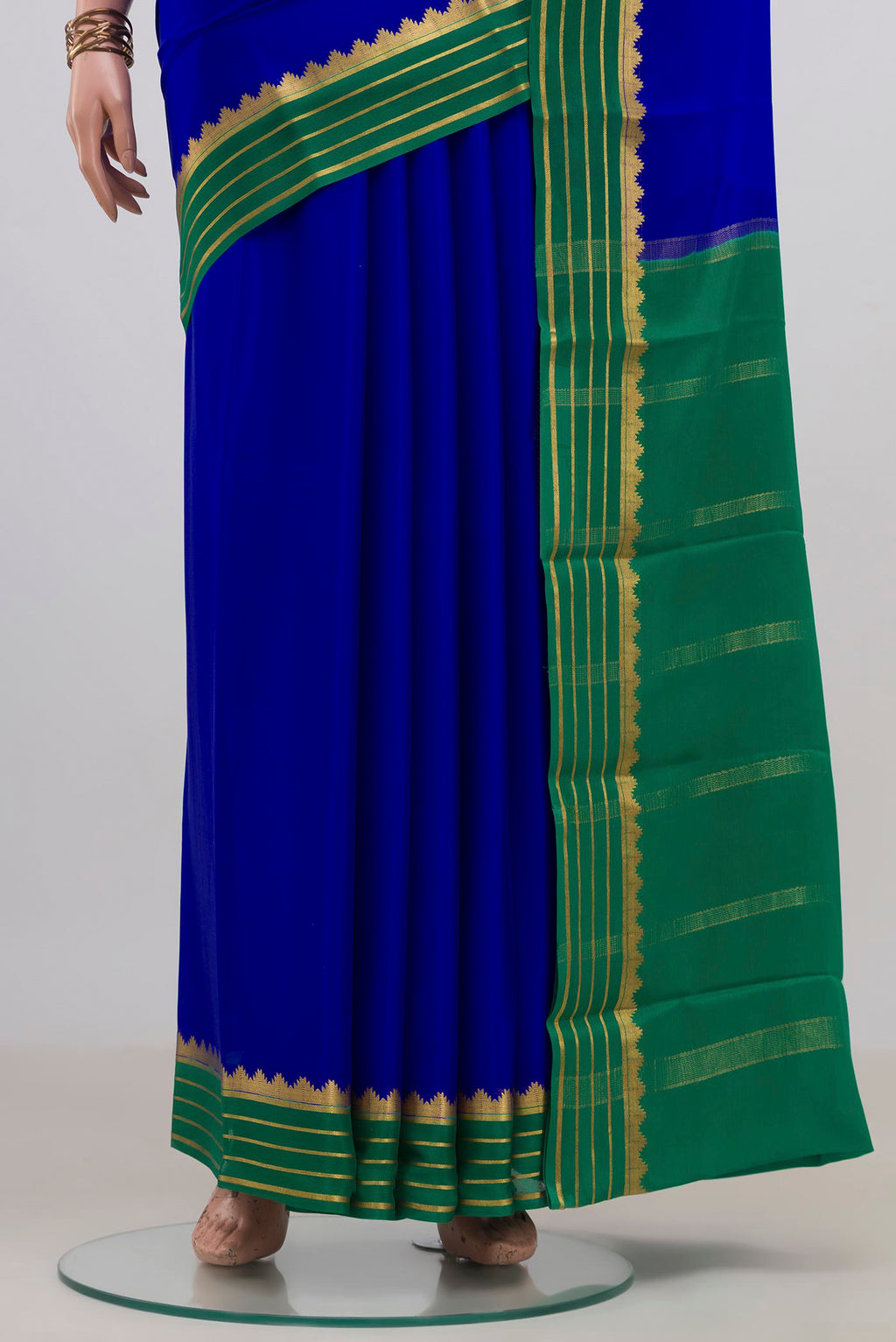 Pleats and pallu of Royal Blue Mysore Crepe Saree with Plain Body and Zari Border. 
