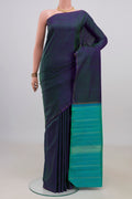 Pure Silk Pure Zari Peacock Blue Dual Tone Kanjivaram Saree with Stripes on the body and Thin Zari Line.  displayed on a mannequin