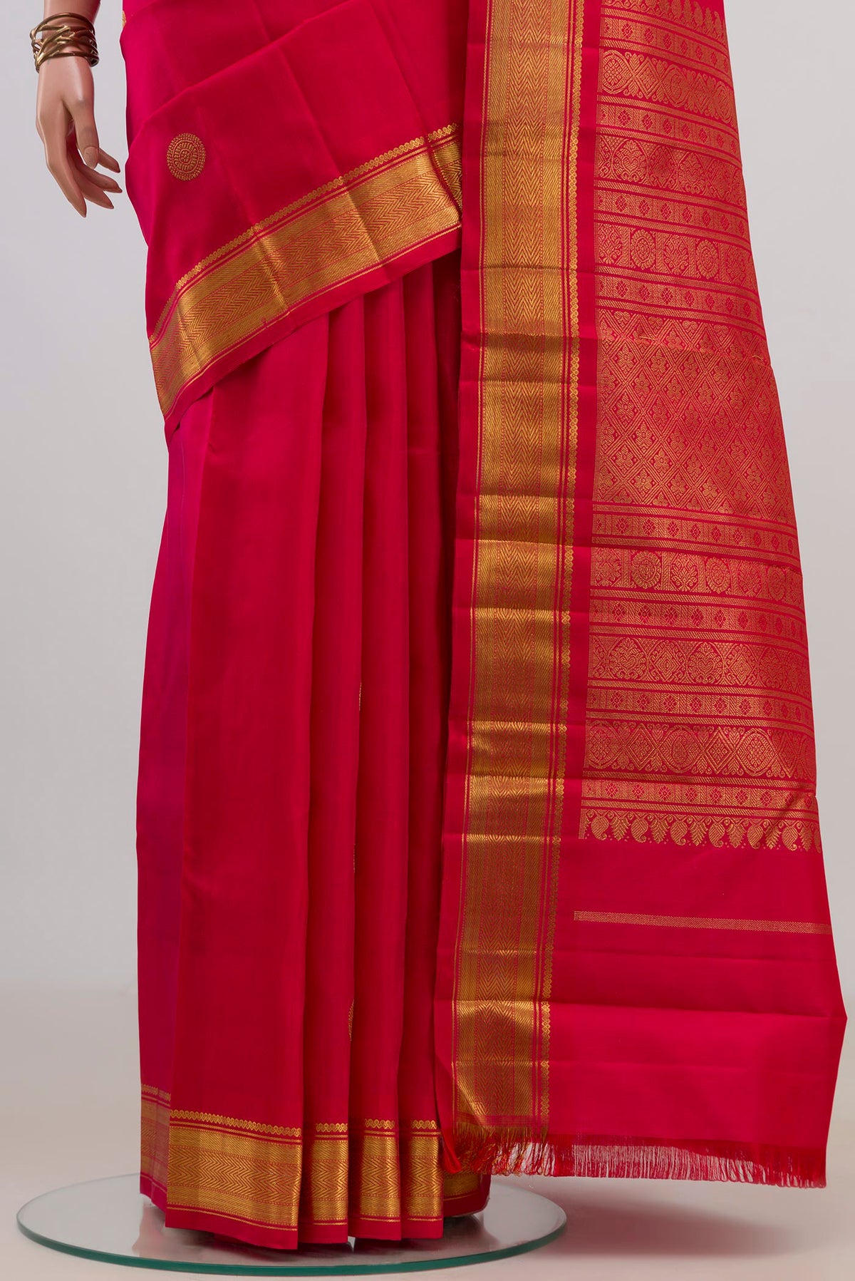 Pleats and pallu of Pure Silk Pure Zari Red Kanchipuram Saree with Zari Butta on the body and Zari Border. 