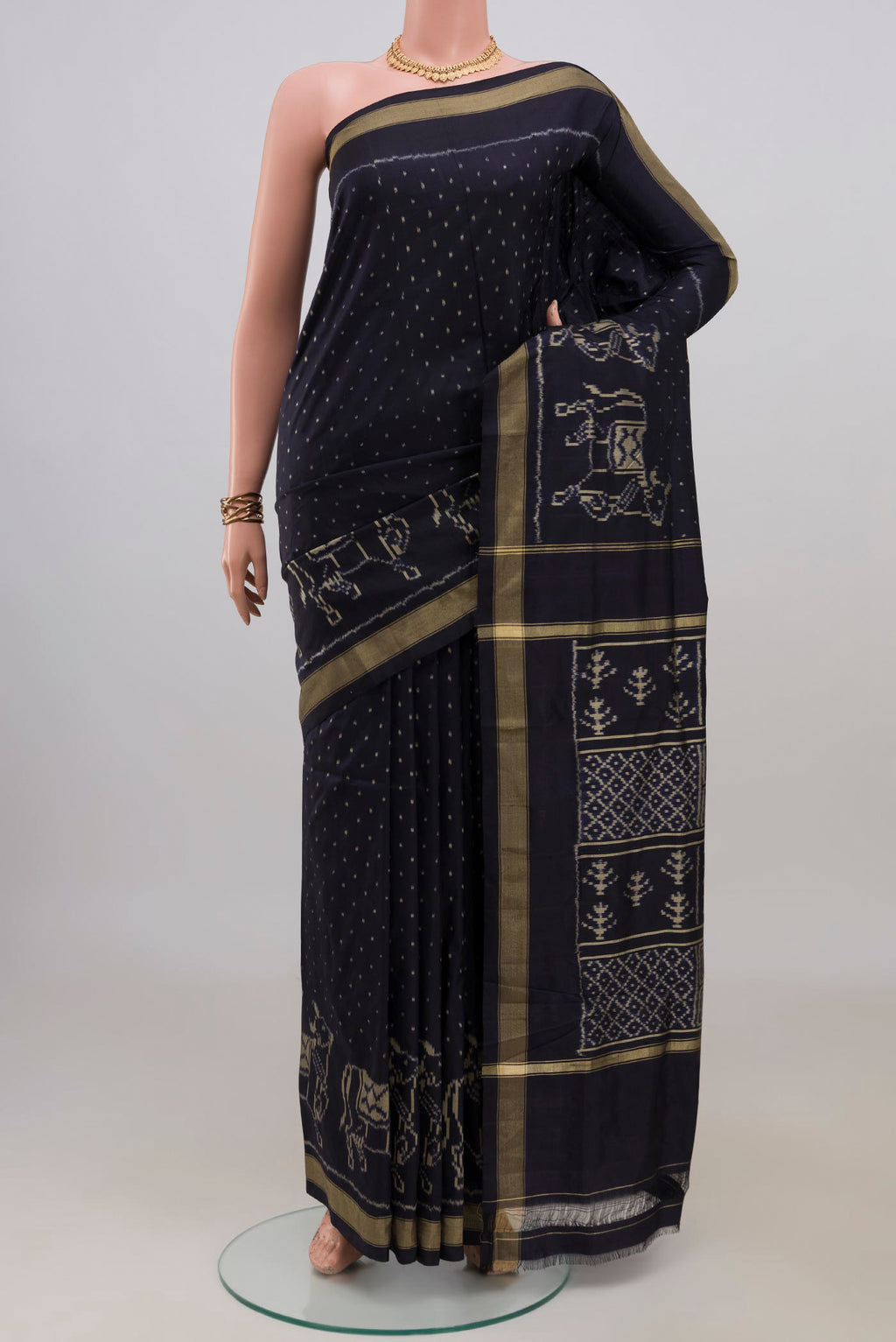 Pure Silk Navy Blue Pochampally Saree with Pure Ikat on the body and Zari Border.  displayed on a mannequin