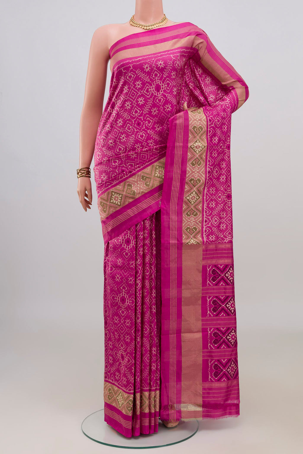 Pure Silk Pink Pochampally Saree with Pure Ikat on the body and Zari Border.  displayed on a mannequin