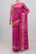 Pure Silk Pink Pochampally Saree with Pure Ikat on the body and Zari Border.  displayed on a mannequin