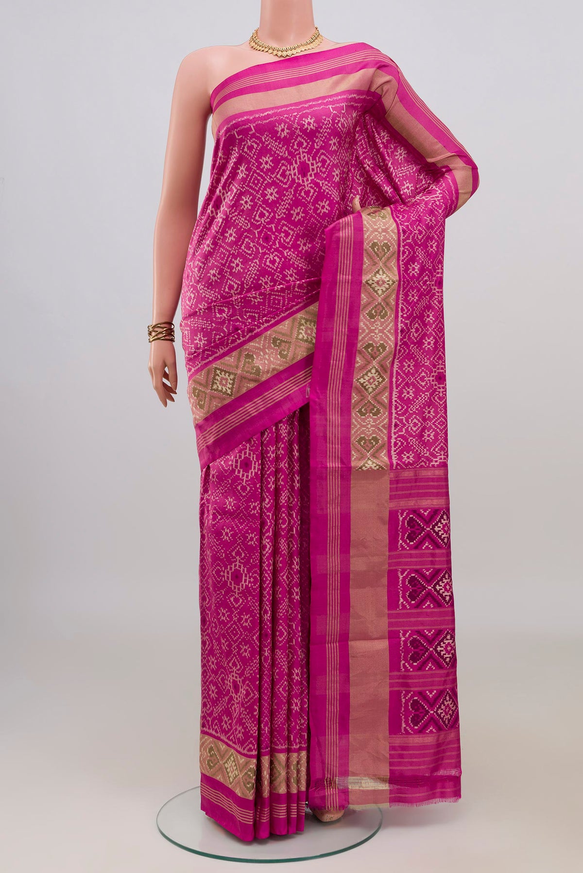 Pure Silk Pink Pochampally Saree with Pure Ikat on the body and Zari Border.  displayed on a mannequin