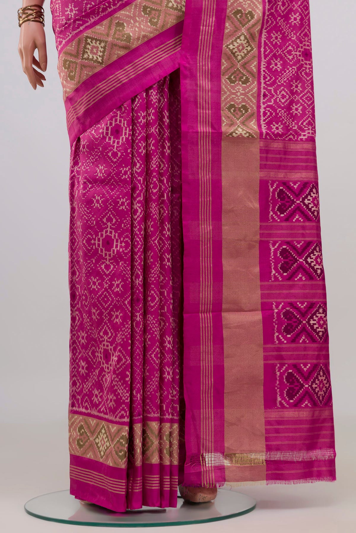 Pleats and pallu of Pure Silk Pink Pochampally Saree with Pure Ikat on the body and Zari Border. 