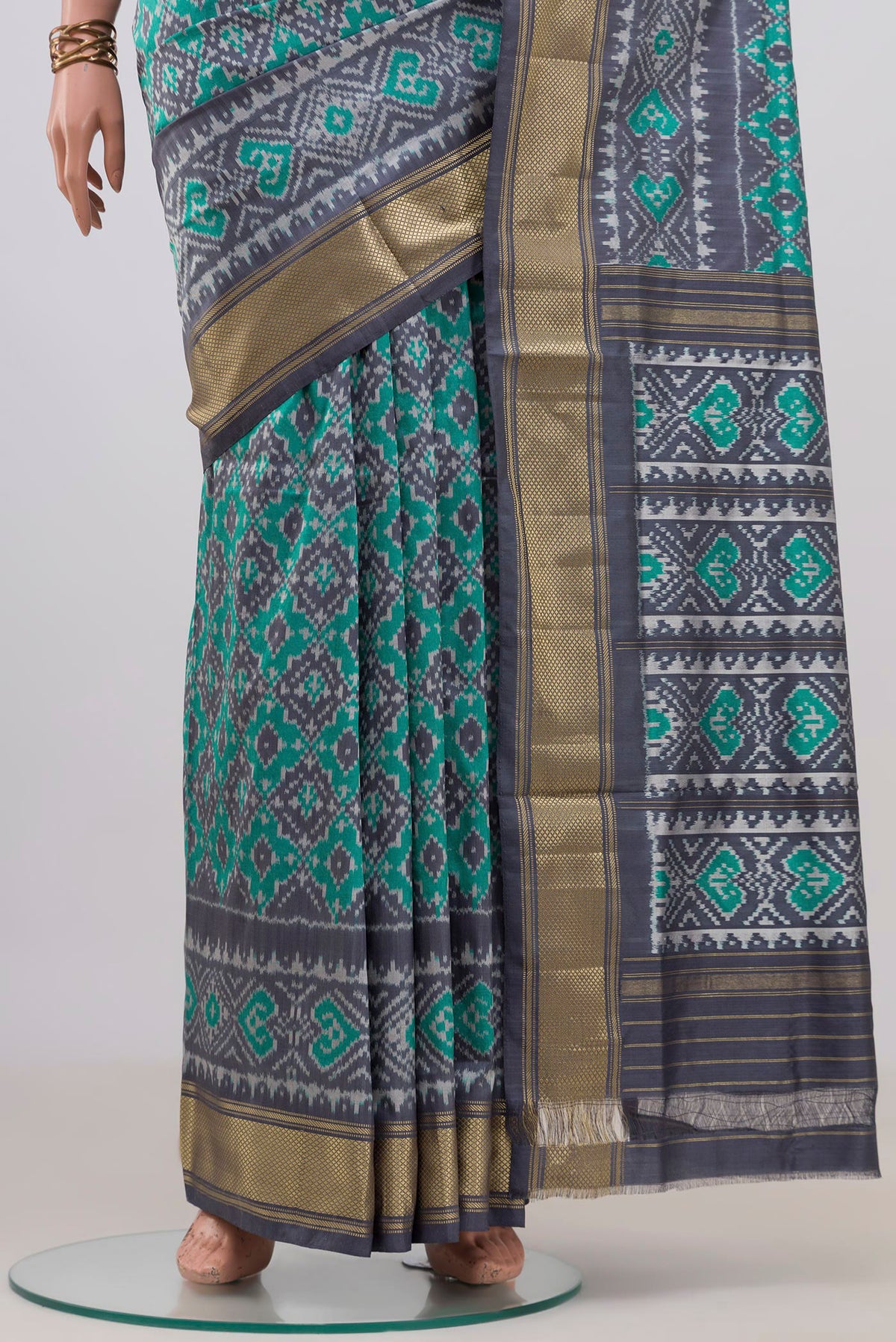 Pleats and pallu of Pure Silk Sea Green Pochampally Saree with Pure Ikat on the body and Zari Border. 