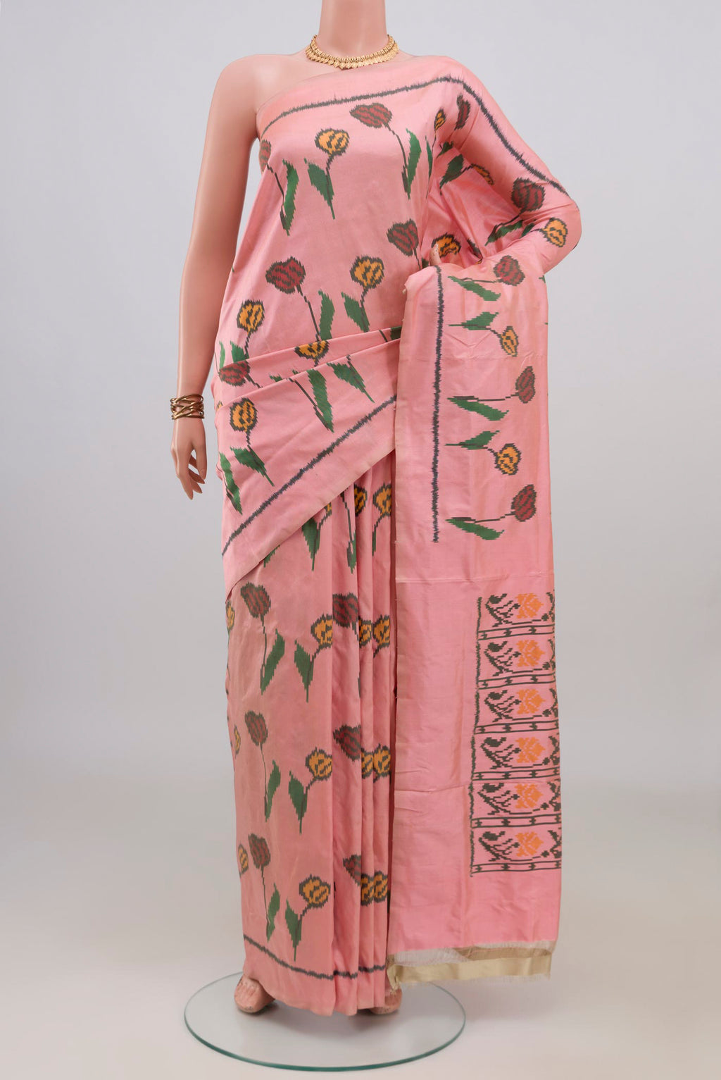 Pure Silk Peach Pochampally Saree with Pure Ikat on the body and Plain Border.  displayed on a mannequin