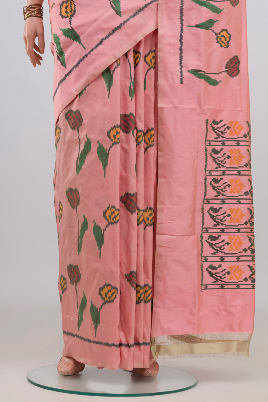 Pleats and pallu of Pure Silk Peach Pochampally Saree with Pure Ikat on the body and Plain Border. 