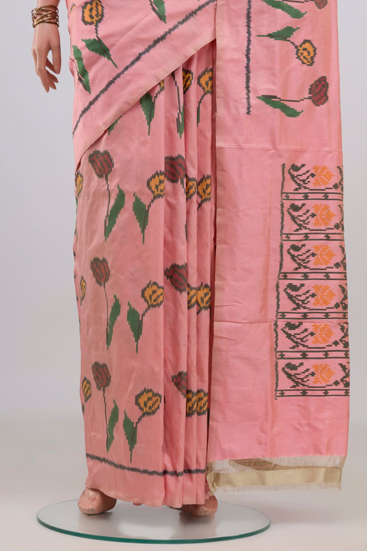 Pleats and pallu of Pure Silk Peach Pochampally Saree with Pure Ikat on the body and Plain Border. 