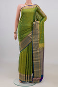 Pure Silk Green Kanchipuram Saree with Zari Butta on the body and Zari Border.  displayed on a mannequin