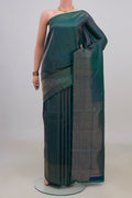 Pure Silk Peacock Blue Dual Tone Kanjivaram Saree with Stripes on the body and Fancy Border.  displayed on a mannequin