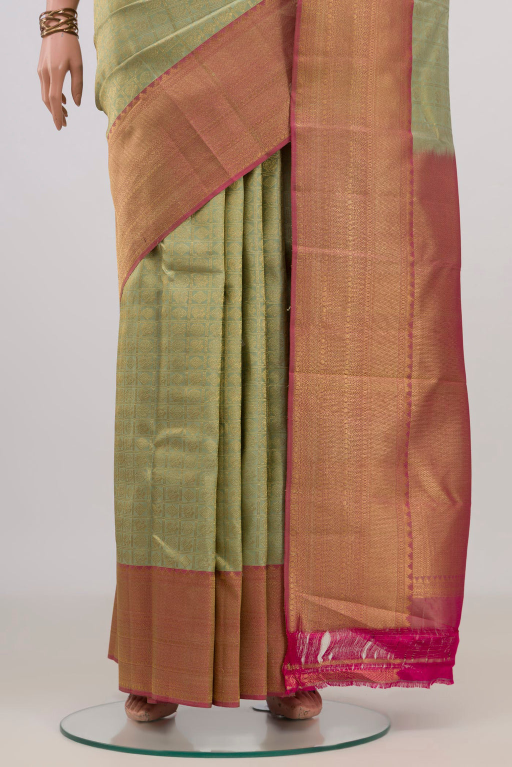 Pleats and pallu of Pure Silk Pista Green Kanchipuram Saree with Zari Brocade on the body and Zari Border. 