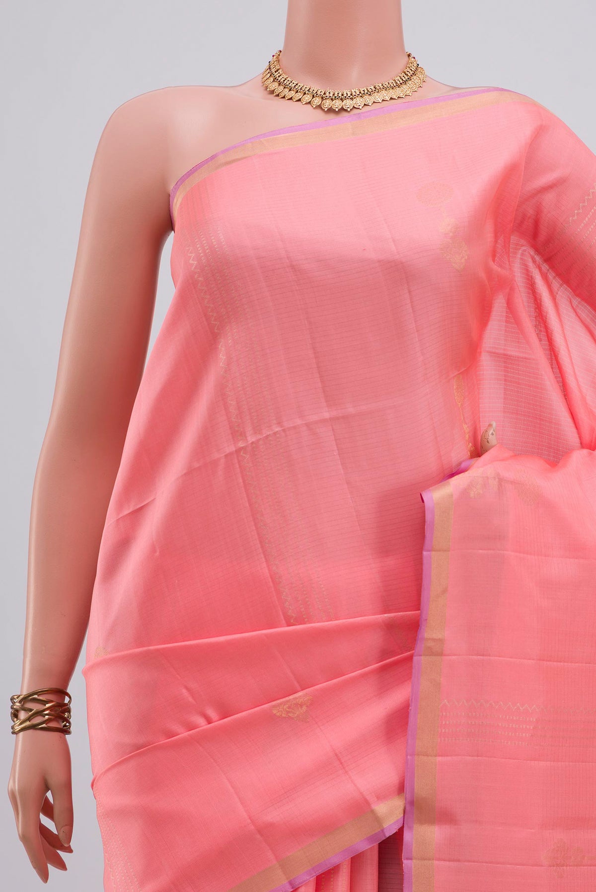 Border image of Pure Silk Peach Soft Saree with Zari Butta on the body and Thin Zari Line. 