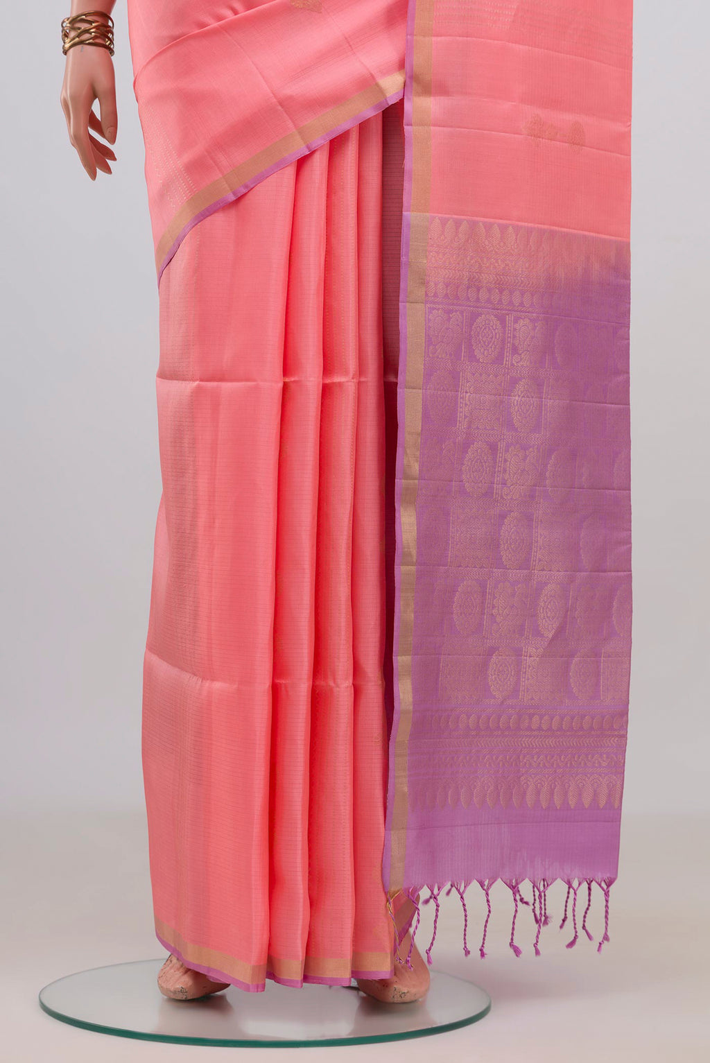Pleats and pallu of Pure Silk Peach Soft Saree with Zari Butta on the body and Thin Zari Line. 