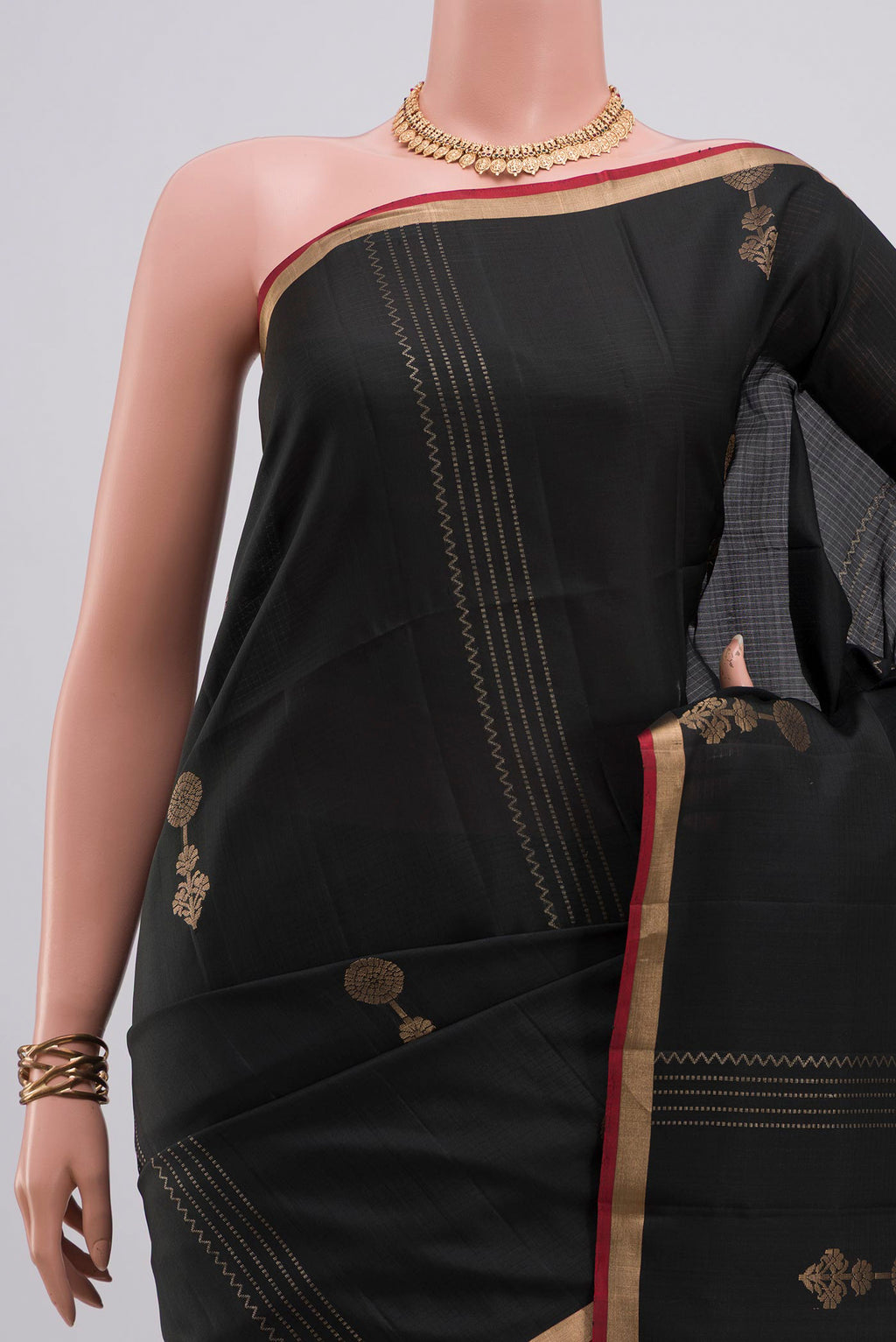 Border image of Pure Silk Black Soft Saree with Zari Butta on the body and Thin Zari Line. 