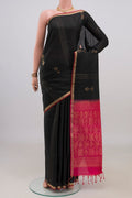 Pure Silk Black Soft Saree with Zari Butta on the body and Thin Zari Line.  displayed on a mannequin