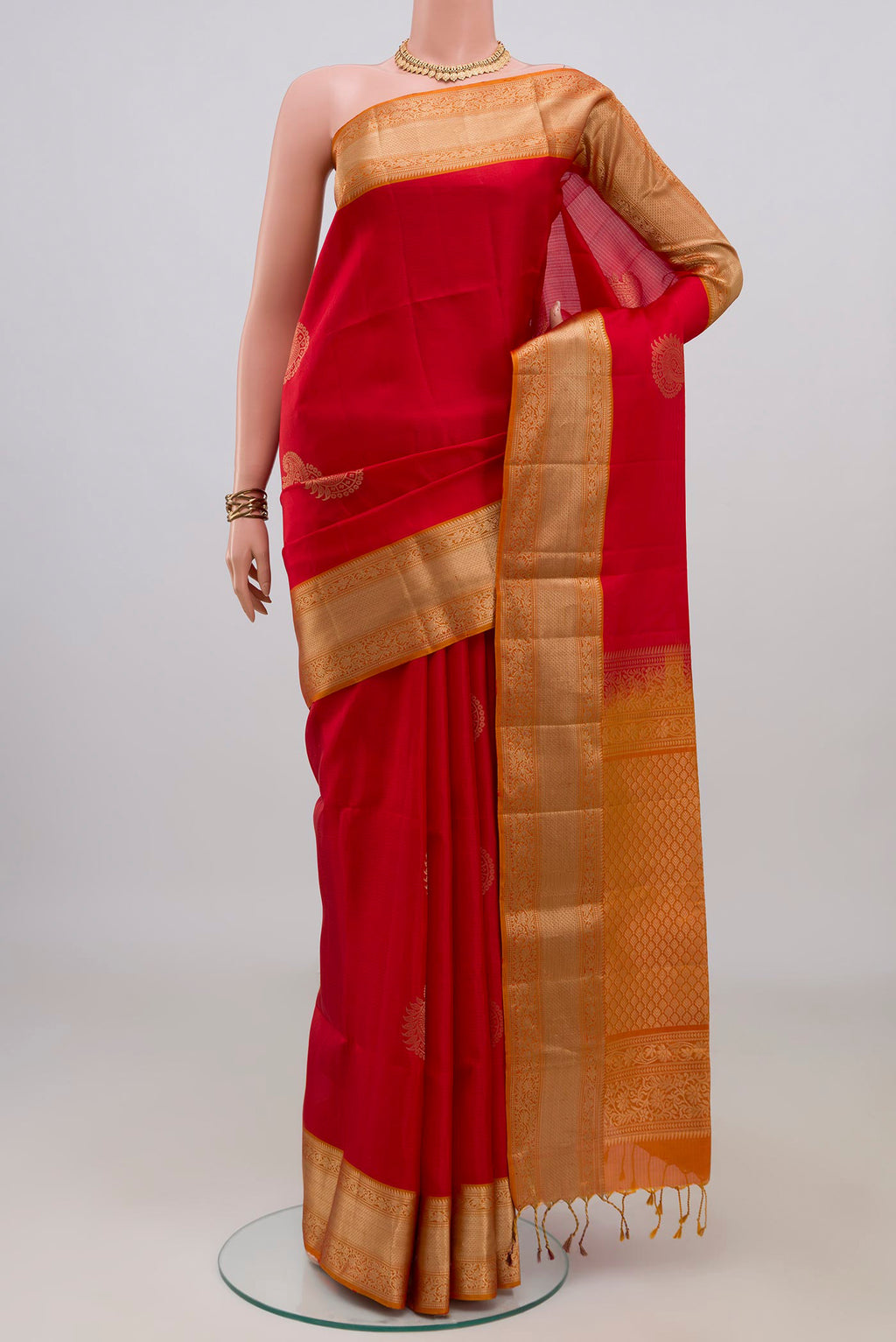 Pure Silk Red Soft Saree with Zari Butta on the body and Zari Border.  displayed on a mannequin