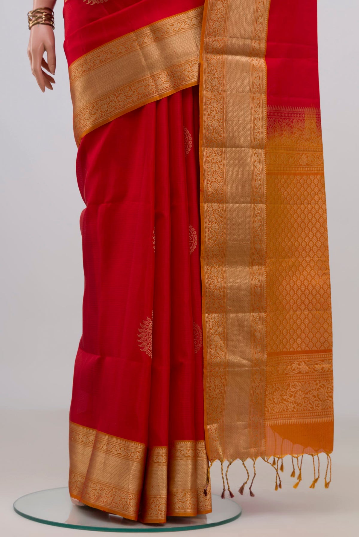 Pleats and pallu of Pure Silk Red Soft Saree with Zari Butta on the body and Zari Border. 