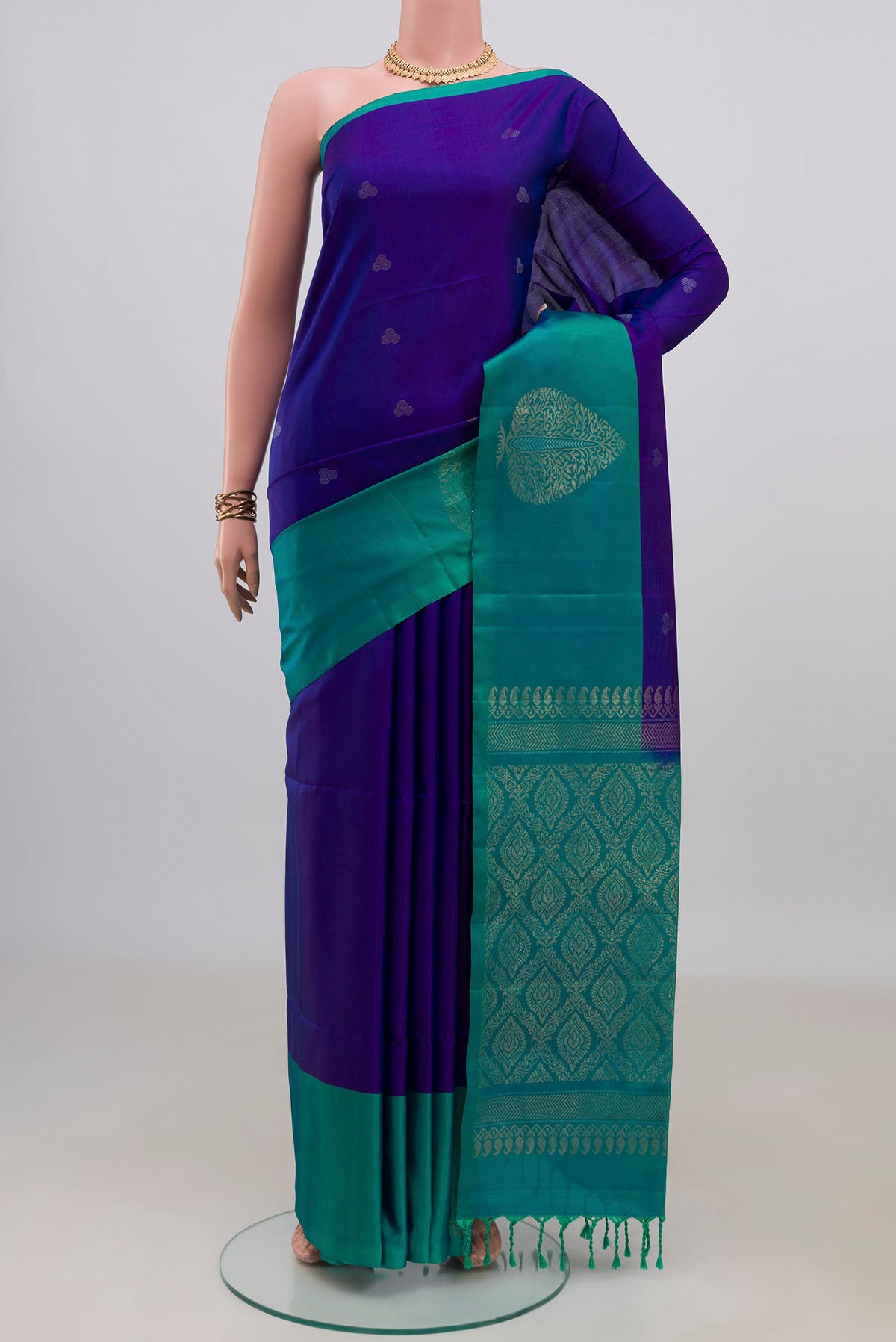 Pure Silk Blue Soft Saree with Zari Butta on the body and Fancy Border.  displayed on a mannequin