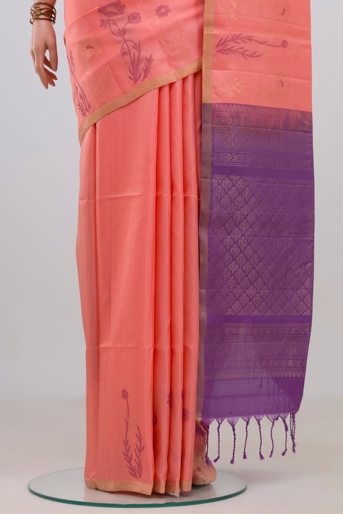 Pleats and pallu of Pure Silk Peach Soft Saree with Zari Butta on the body and Thin Zari Line. 