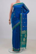 Pure Silk Blue Soft Saree with Zari Butta on the body and Thin Zari Line.  displayed on a mannequin