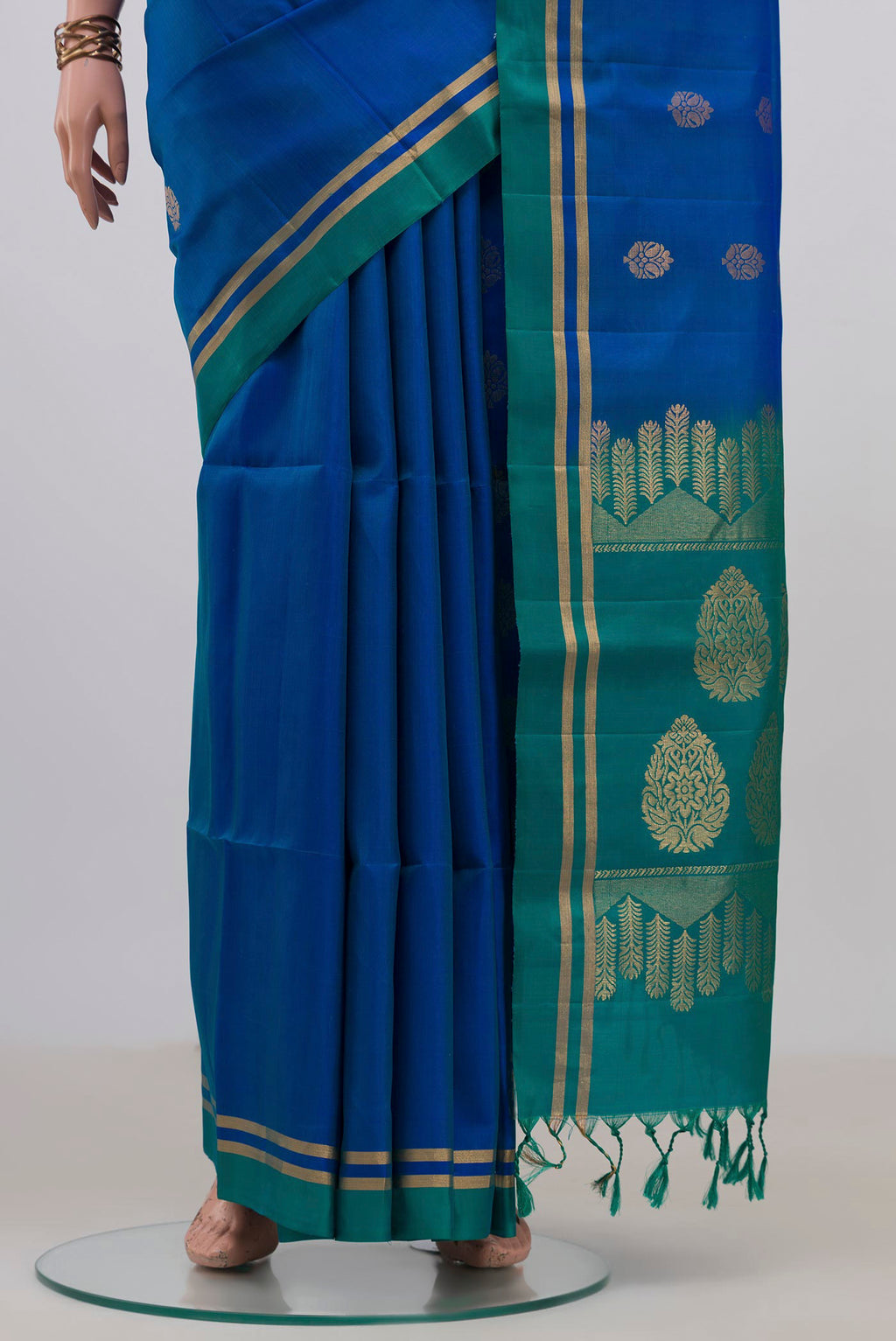 Pleats and pallu of Pure Silk Blue Soft Saree with Zari Butta on the body and Thin Zari Line. 