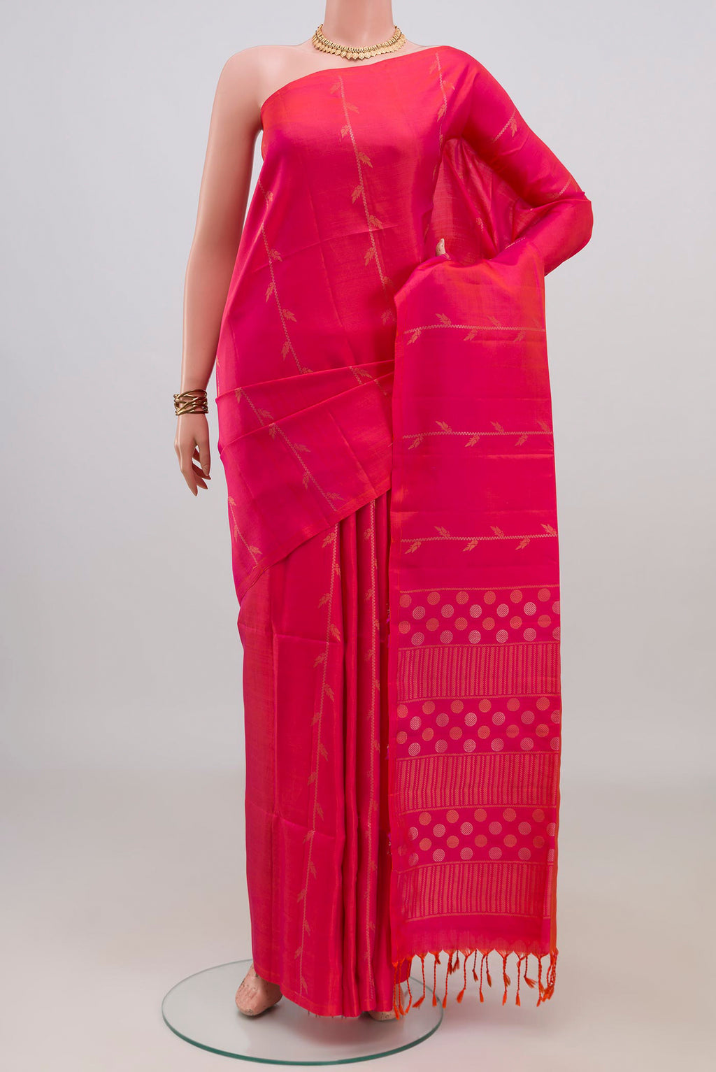 Pure Silk Pink Soft Saree with Zari Butta on the body and Without Border.  displayed on a mannequin