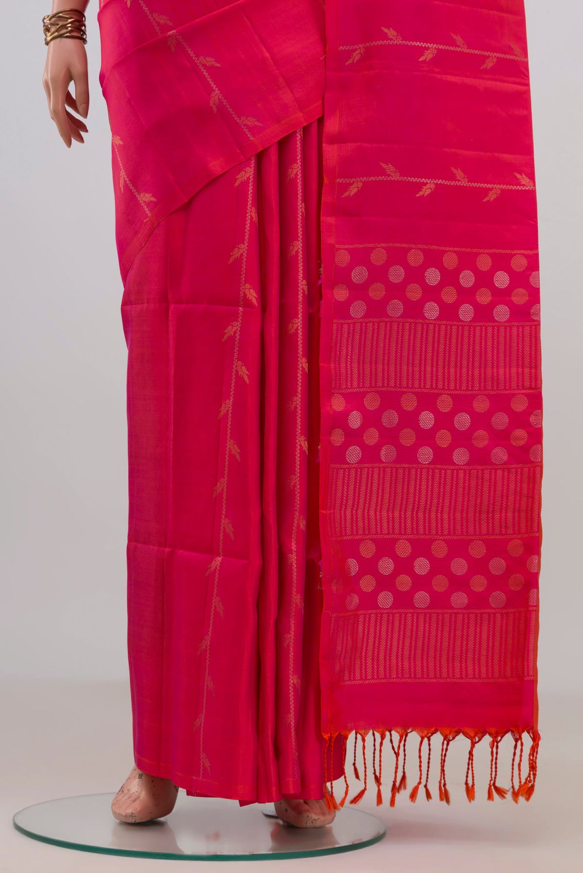 Pleats and pallu of Pure Silk Pink Soft Saree with Zari Butta on the body and Without Border. 