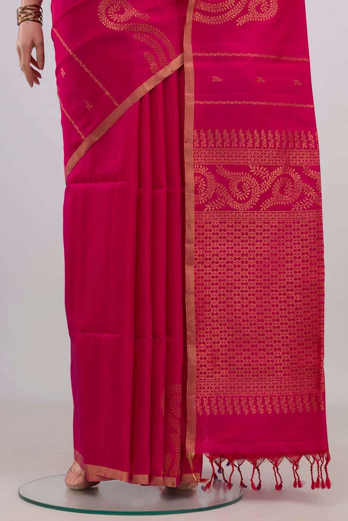 Pleats and pallu of Pure Silk Pink Soft Saree with Zari Butta on the body and Thin Zari Line. 