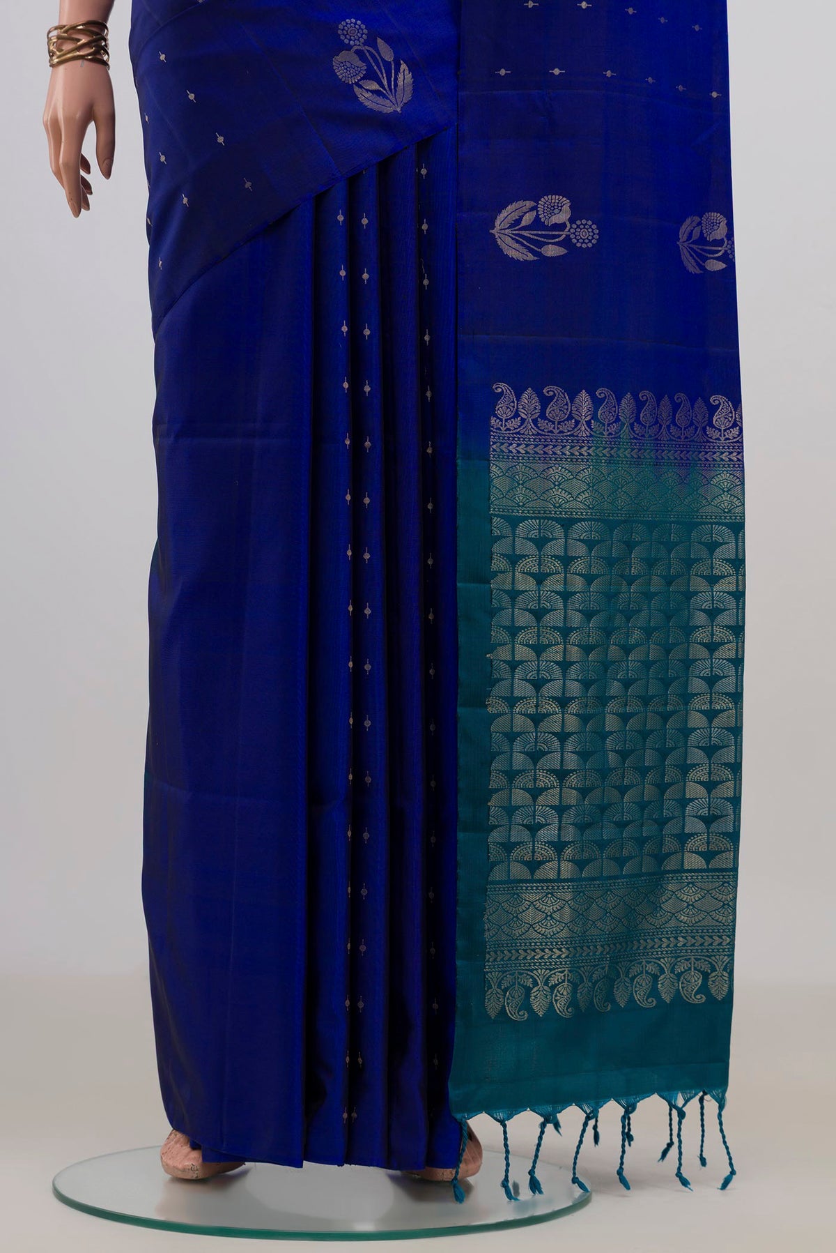 Pleats and pallu of Pure Silk Royal Blue Soft Saree with Zari Butta on the body and Without Border. 