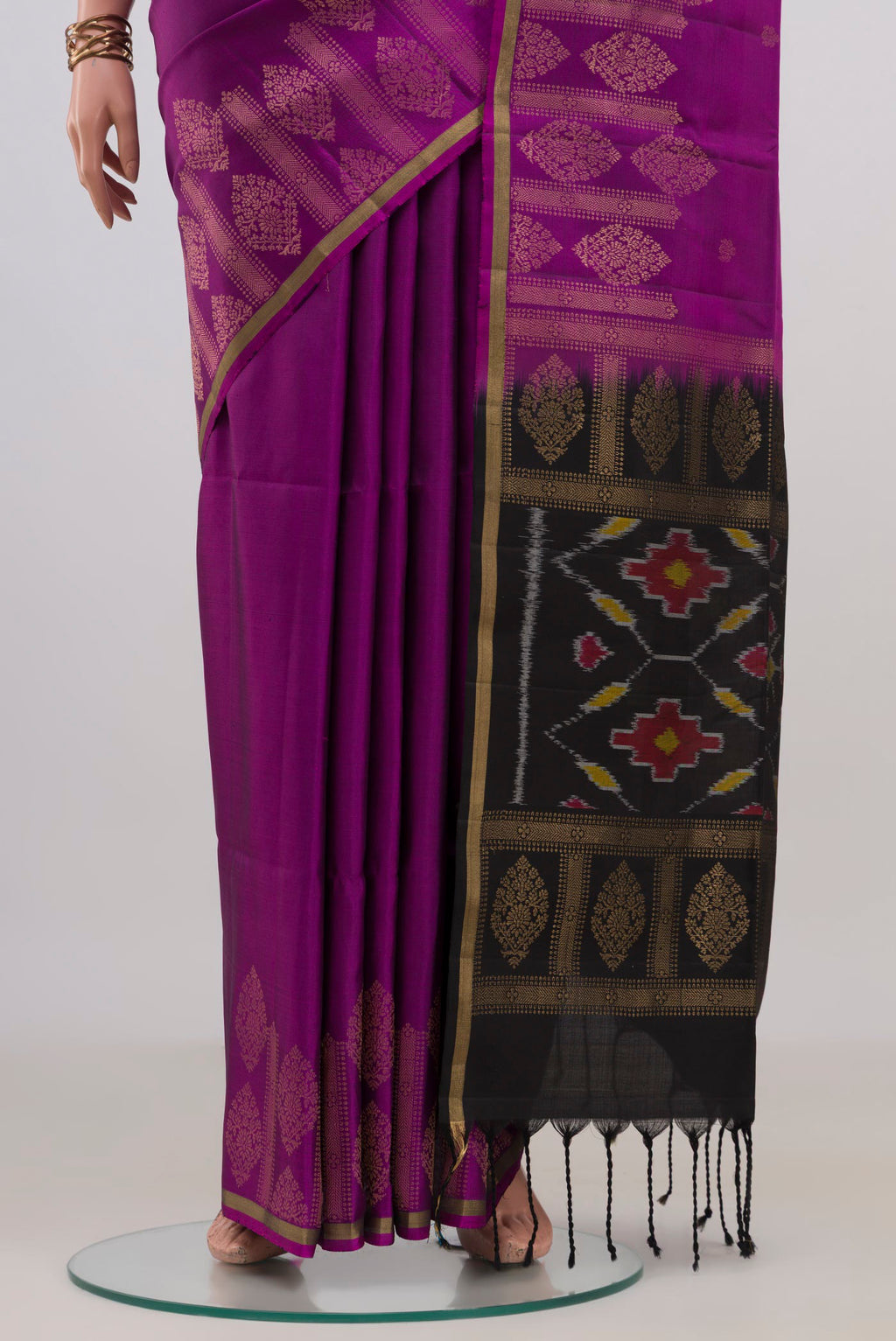 Pleats and pallu of Pure Silk Purple Soft Saree with Zari Butta on the body and Thin Zari Line. 
