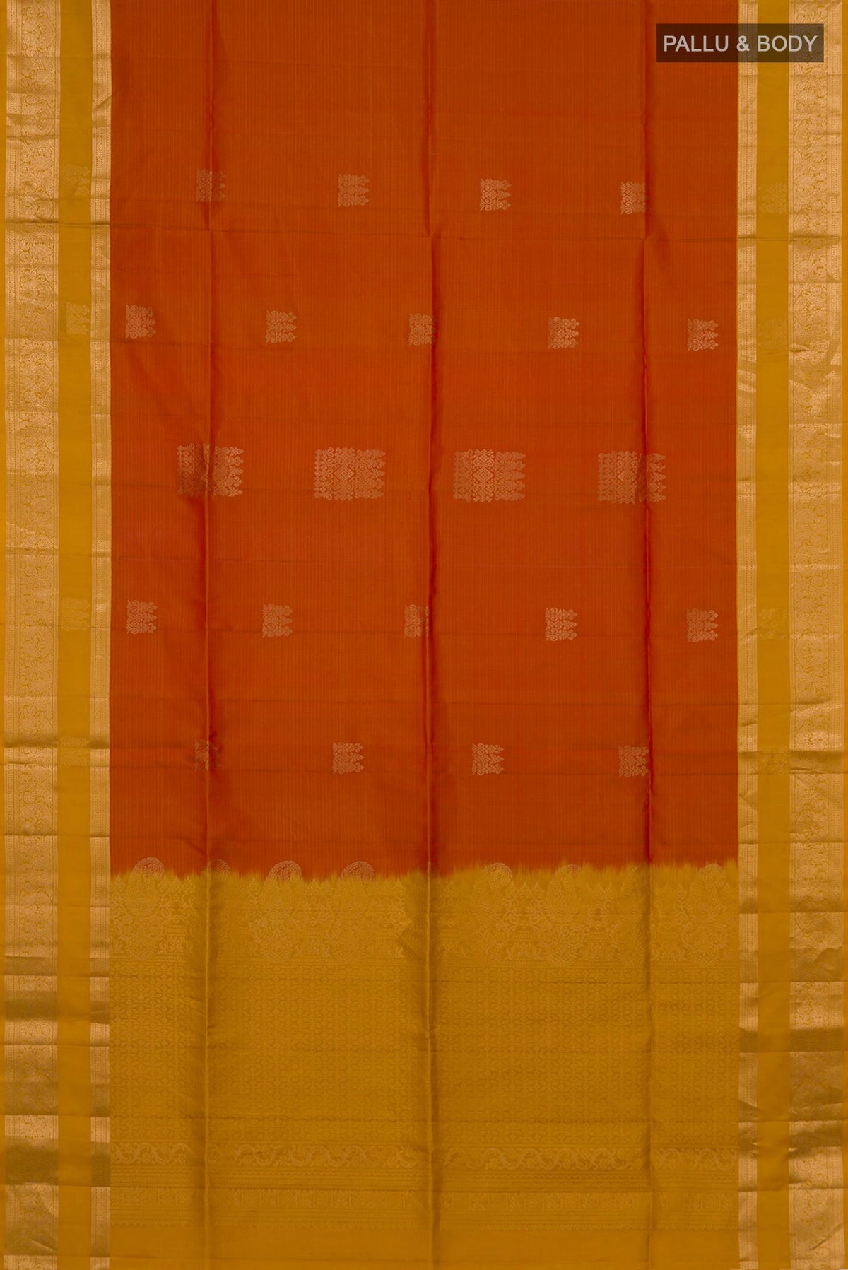 Flat view of Pure Silk Brick Orange Soft Saree with Zari Butta on the body and Zari Border. 
