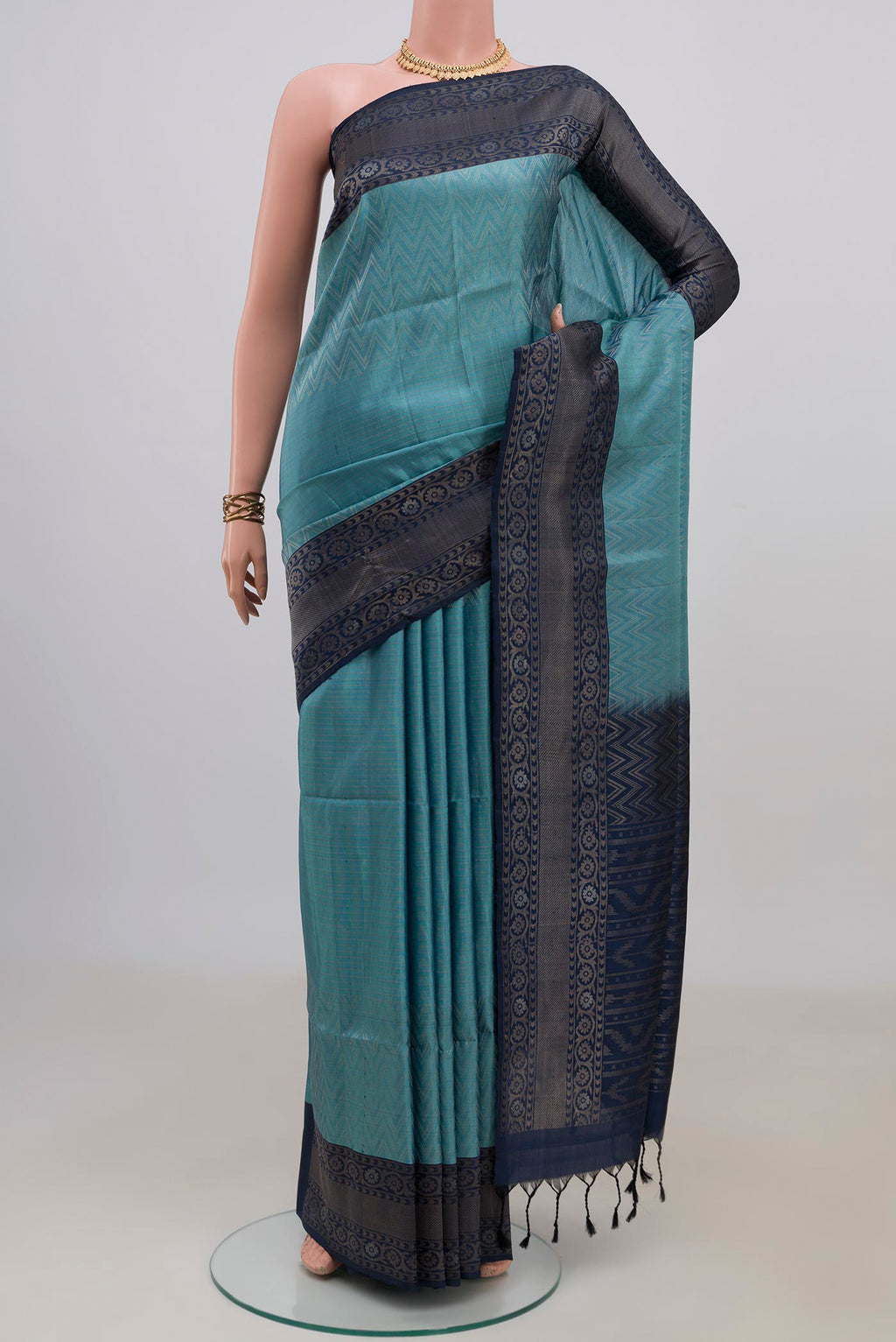Pure Silk Light Blue Soft Saree with Zari Brocade on the body and Fancy Border.  displayed on a mannequin