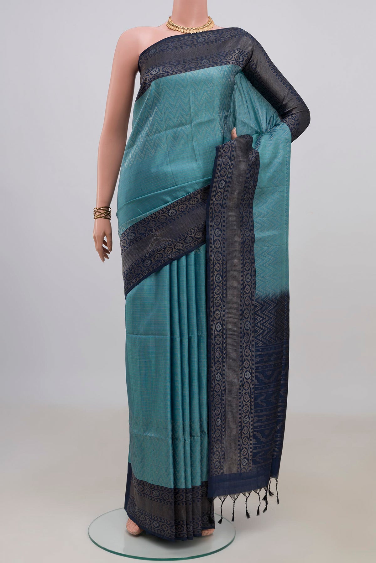 Pure Silk Light Blue Soft Saree with Zari Brocade on the body and Fancy Border.  displayed on a mannequin