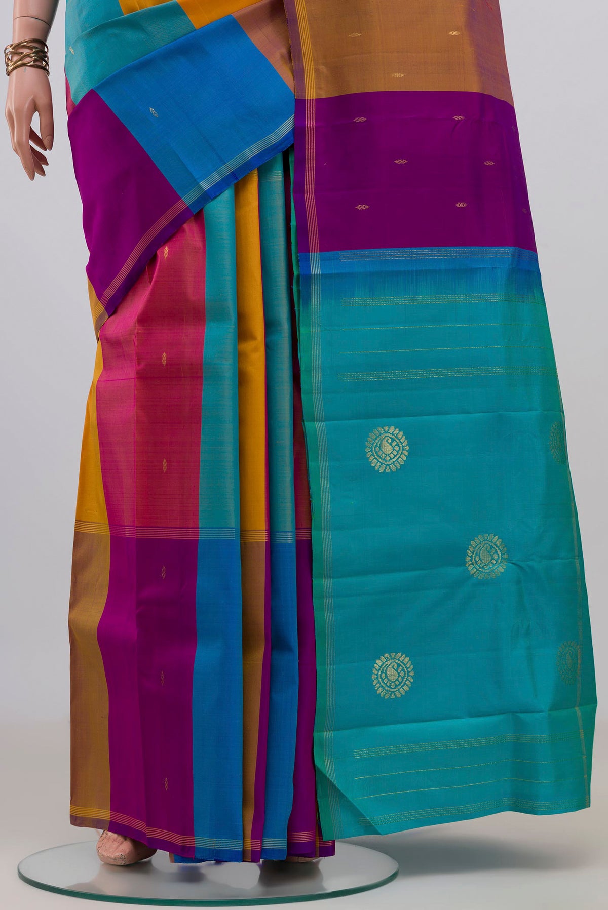 Pleats and pallu of Pure Silk Multi Color Kanchipuram Saree with Stripes on the body and Thin Zari Line. 