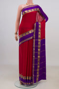 Red Mysore Crepe Saree with Plain Body and Zari Border.  displayed on a mannequin