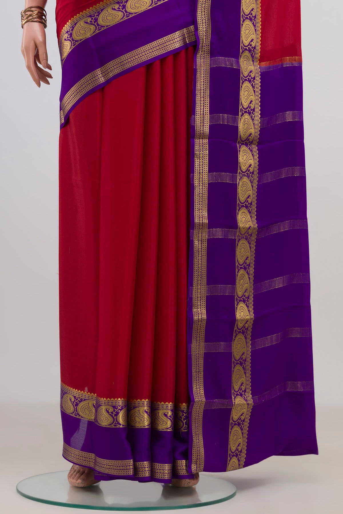 Pleats and pallu of Red Mysore Crepe Saree with Plain Body and Zari Border. 