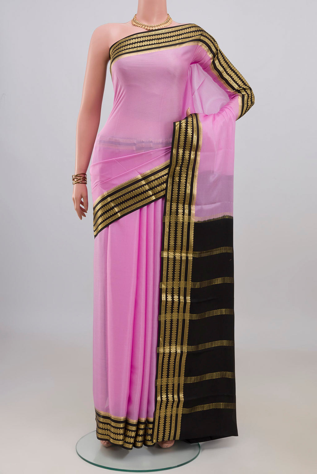 Pink Mysore Crepe Saree with Zari Butta on the body and Zari Border.  displayed on a mannequin