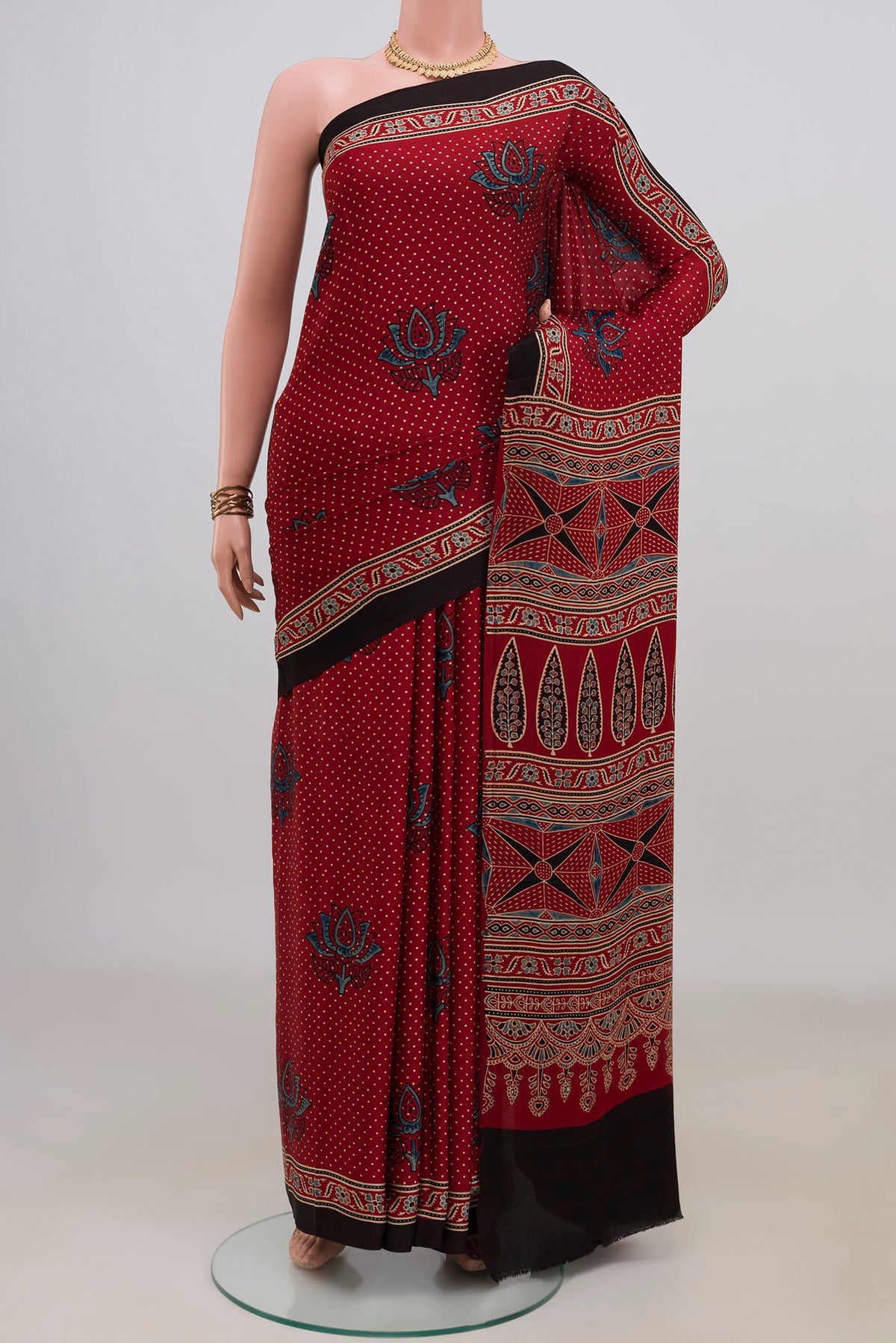Maroon Blended Satin Silk Saree with Ajrakh Print on the body and Without Border.  displayed on a mannequin