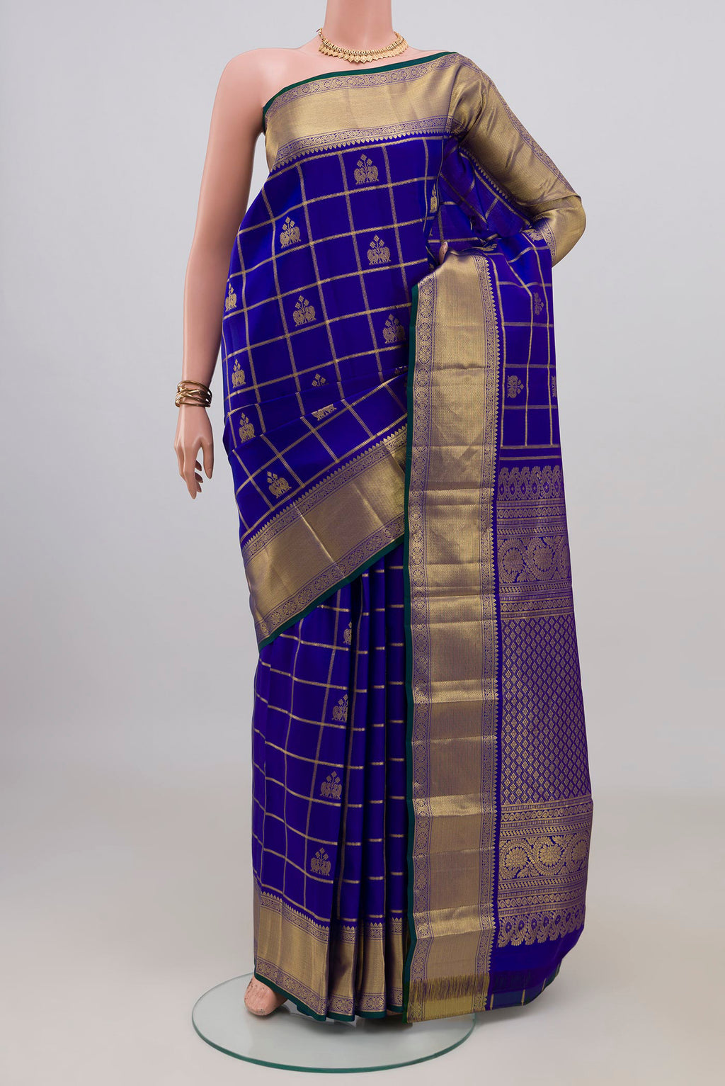 Pure Silk Royal Blue Kanchipuram Saree with Checked design on the body and Zari Border.  displayed on a mannequin