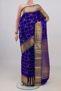 Pure Silk Royal Blue Kanchipuram Saree with Checked design on the body and Zari Border.  displayed on a mannequin