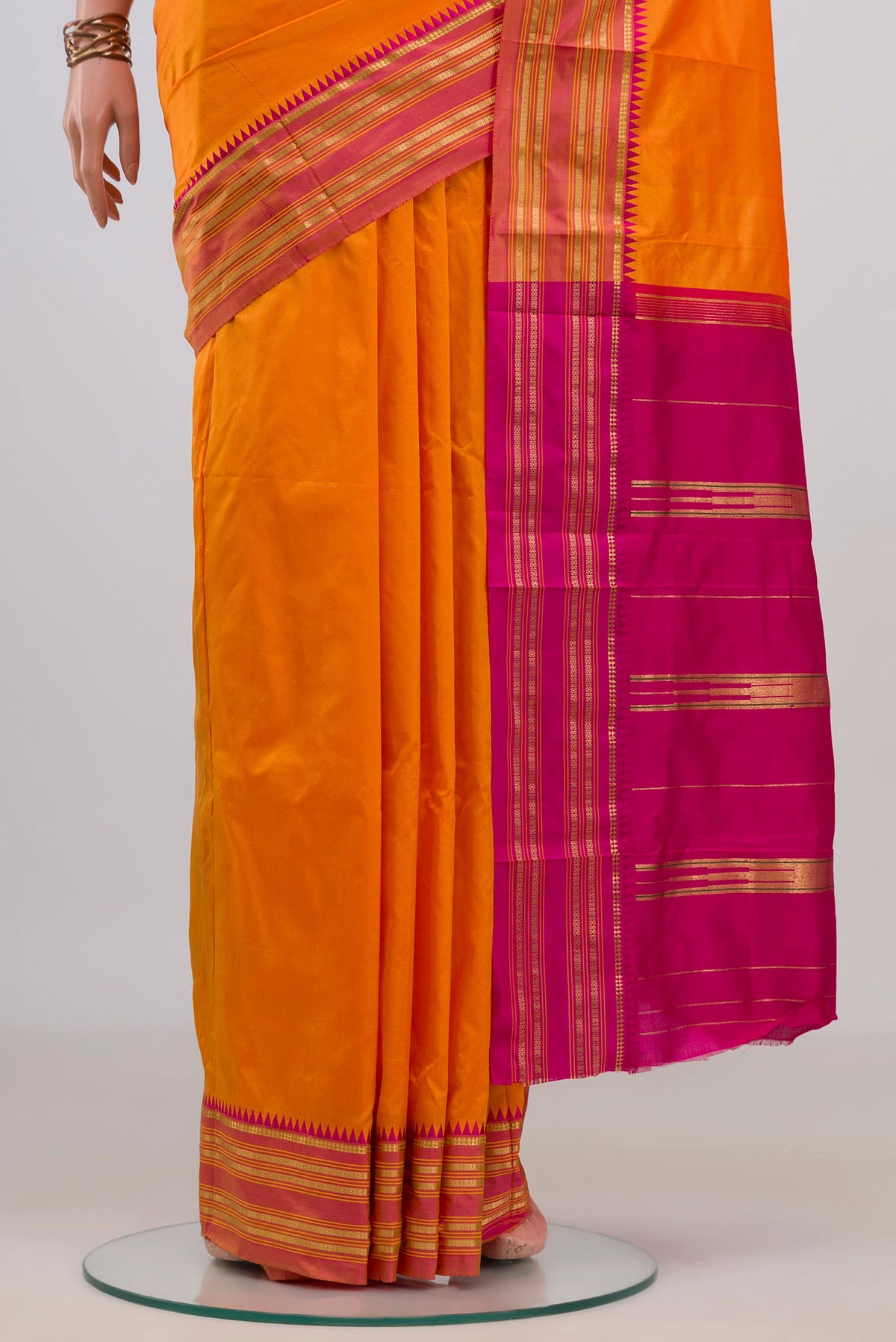 Pleats and pallu of Pure Silk Orange Narayanpet Saree with Plain Body and Zari Border. 