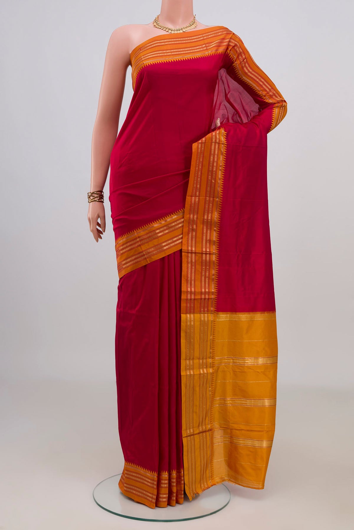 Pure Silk Red Narayanpet Saree with Plain Body and Zari Border.  displayed on a mannequin