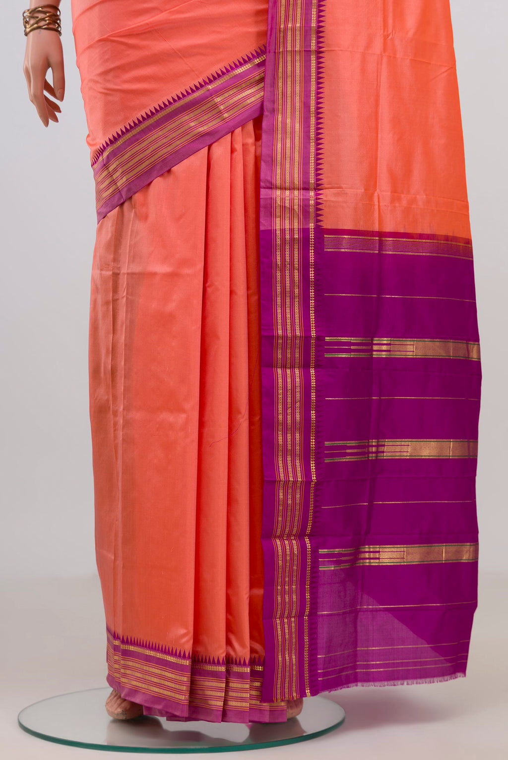 Pleats and pallu of Pure Silk Peach Narayanpet Saree with Plain Body and Zari Border. 
