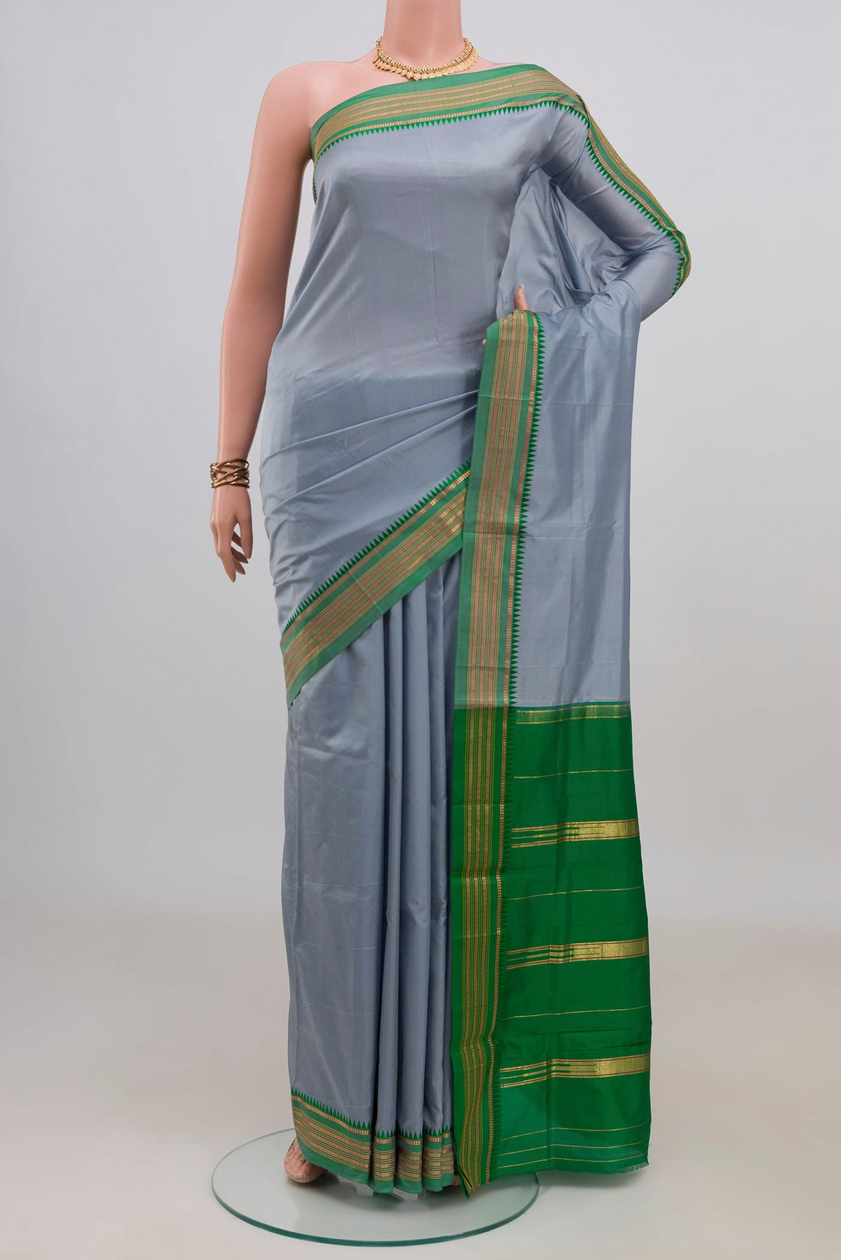 Pure Silk Grey Narayanpet Saree with Plain Body and Zari Border.  displayed on a mannequin