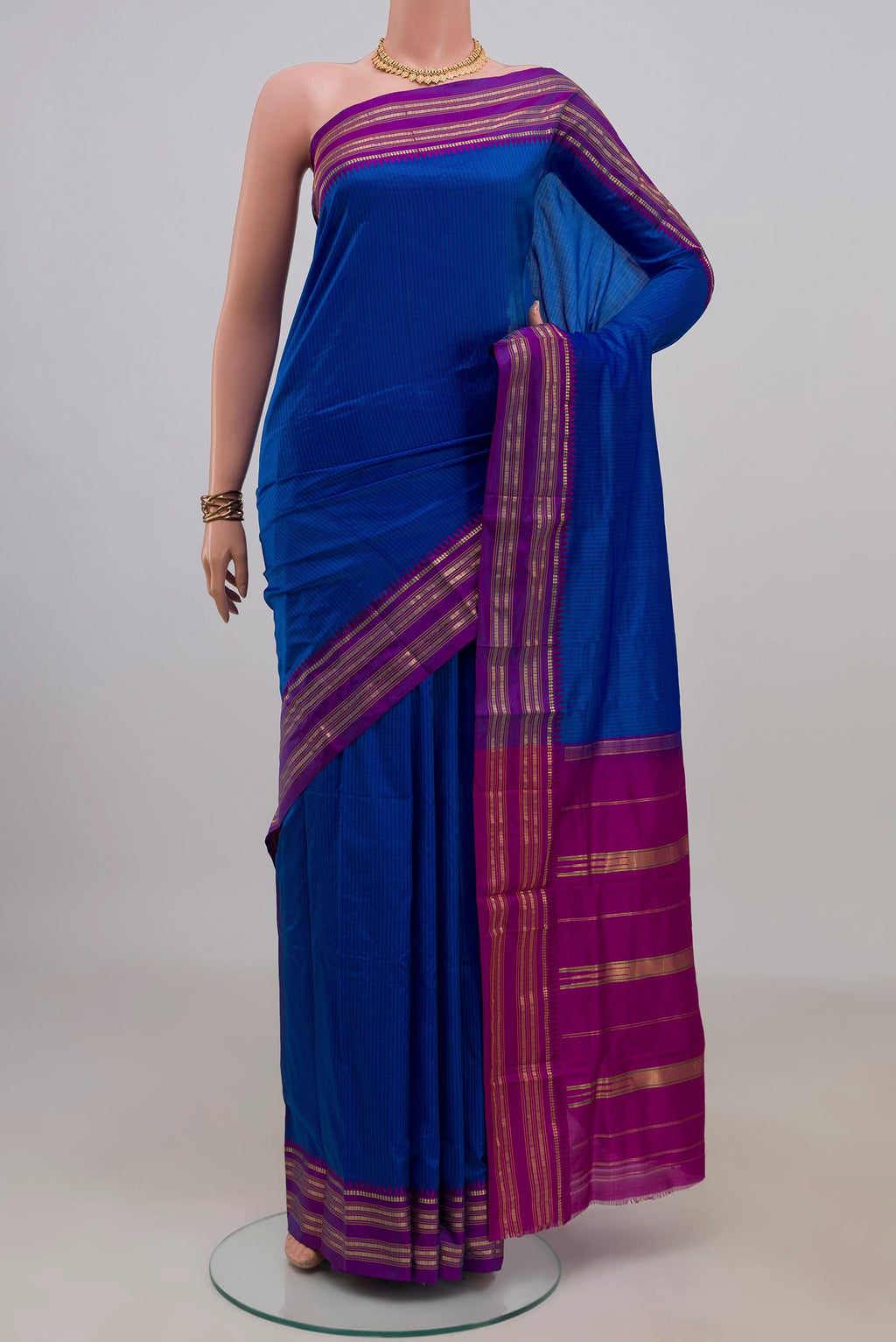 Pure Silk Royal Blue Narayanpet Saree with Checked design on the body and Zari Border.  displayed on a mannequin