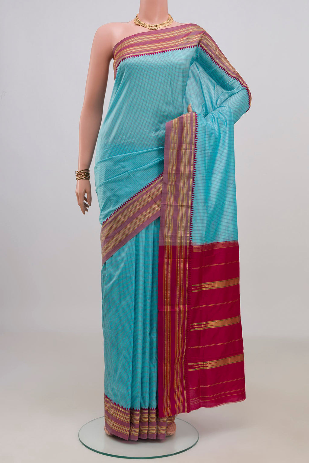 Pure Silk Light Blue Narayanpet Saree with Checked design on the body and Zari Border.  displayed on a mannequin
