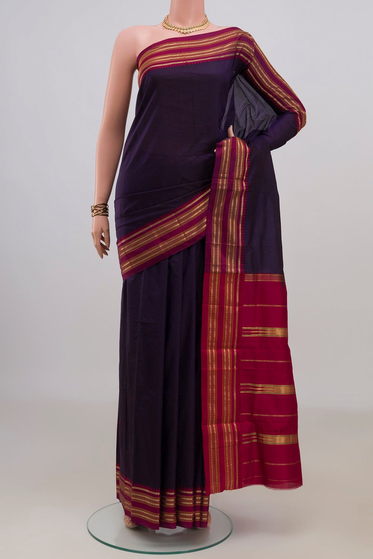 Pure Silk Navy Blue Narayanpet Saree with Checked design on the body and Zari Border.  displayed on a mannequin