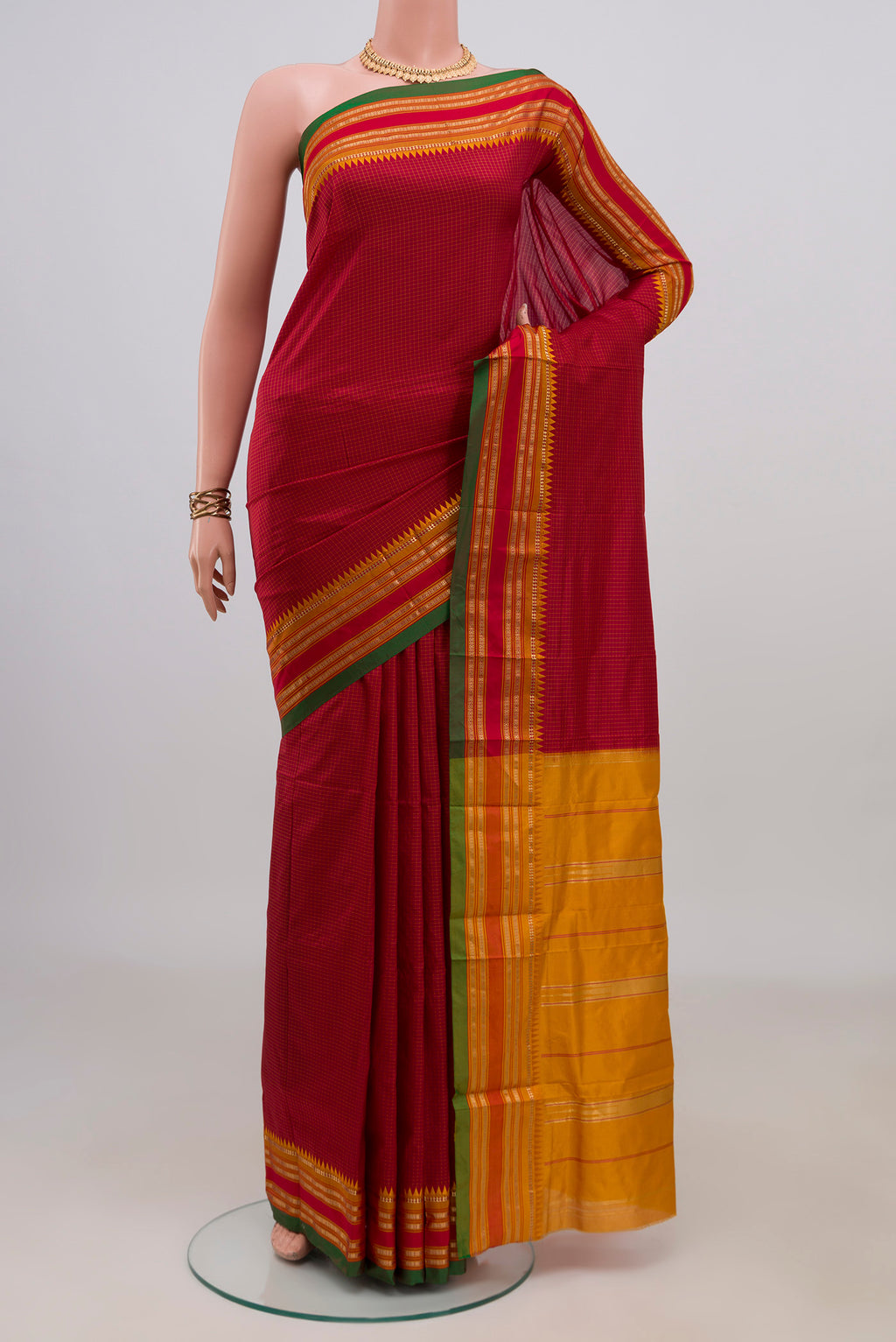 Pure Silk Red Narayanpet Saree with Checked design on the body and Zari Border.  displayed on a mannequin