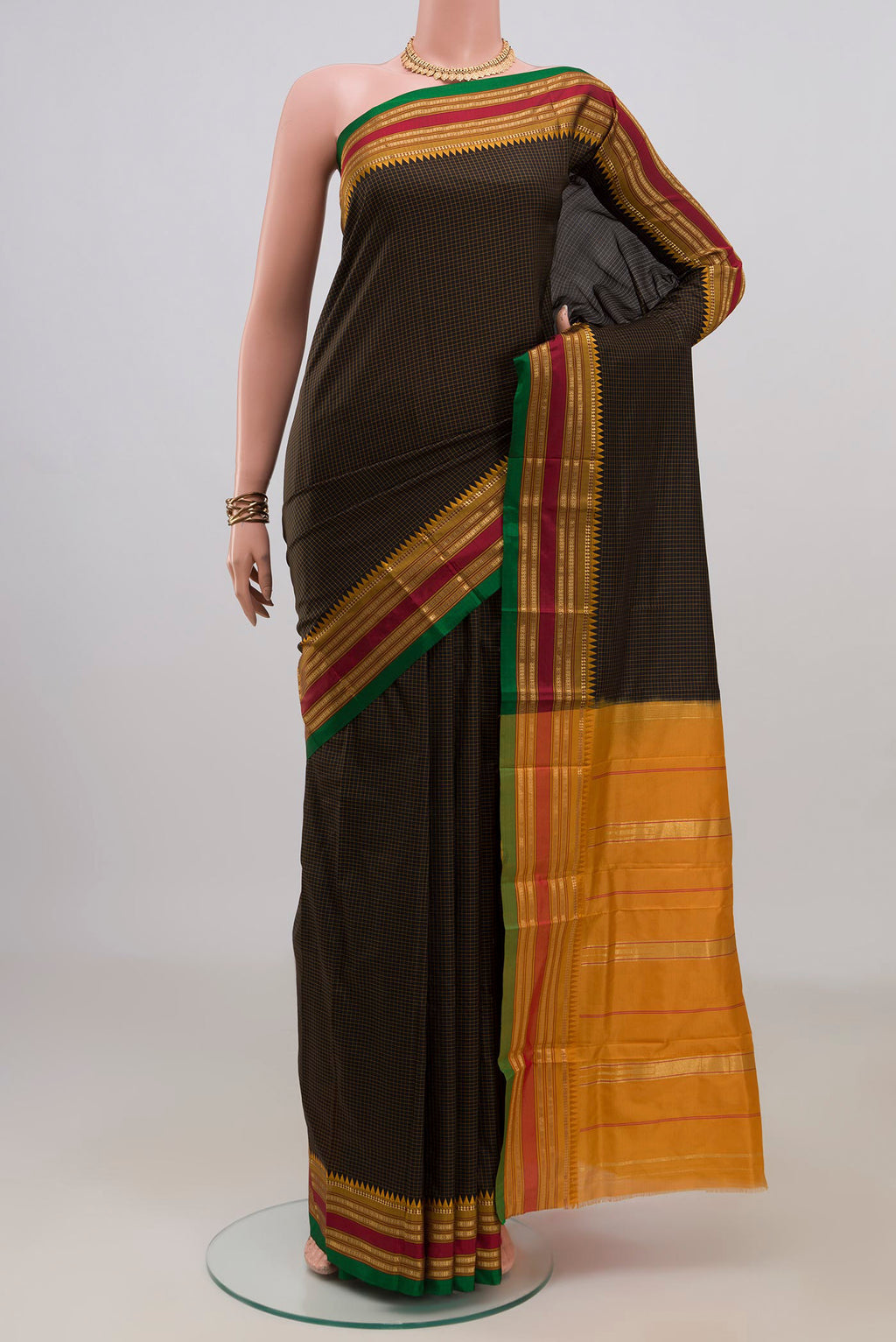 Pure Silk Black Narayanpet Saree with Checked design on the body and Zari Border.  displayed on a mannequin