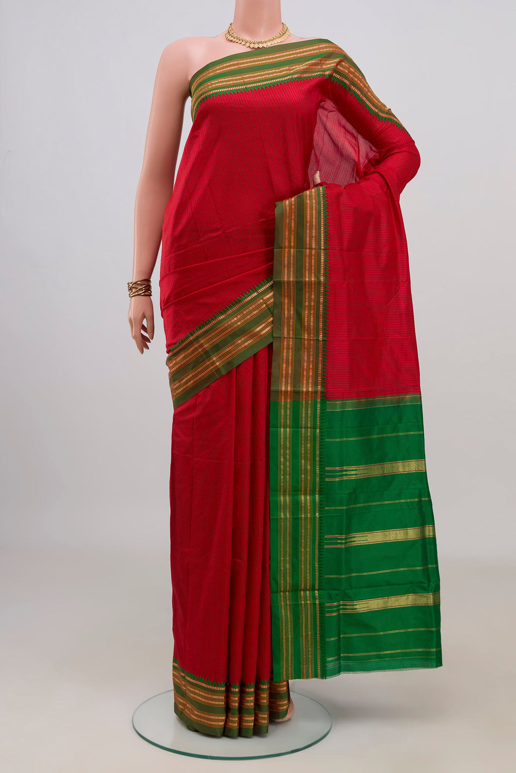 Pure Silk Red Narayanpet Saree with Checked design on the body and Zari Border.  displayed on a mannequin